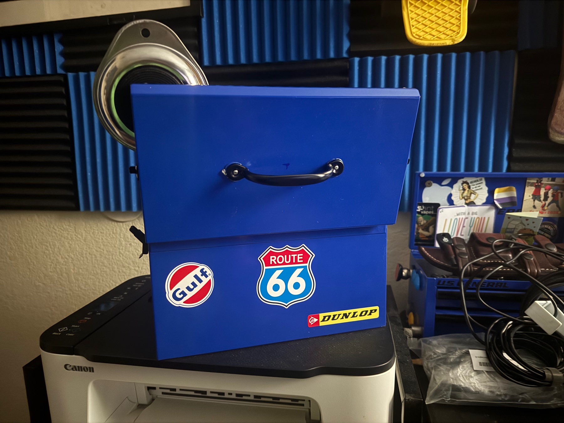 Mini toolbox showing backside with handle on top.